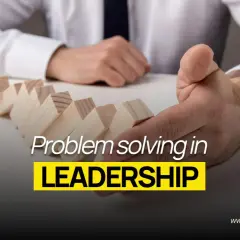 Dr. Michelle Rozen, "The Change Doctor," demonstrates problem-solving in leadership with dominoes. This image is part of leadership coaching news.