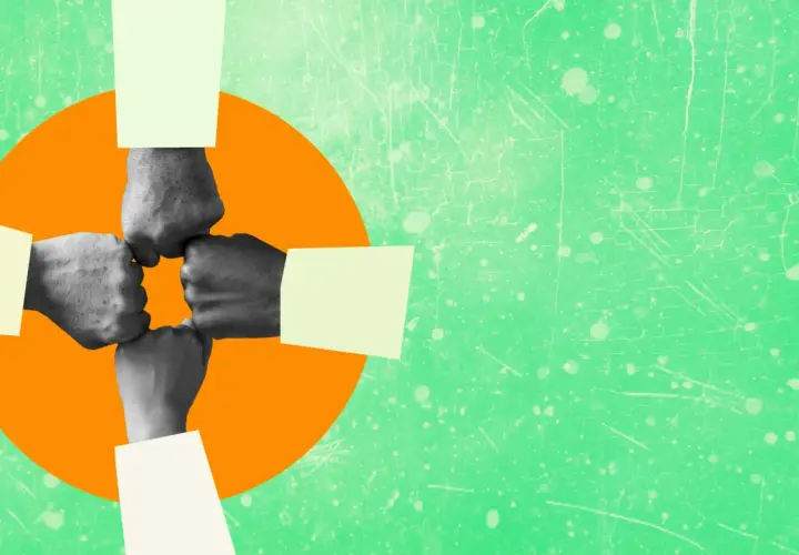 Four fists bump in a circle, symbolizing authentic leadership and teamwork.