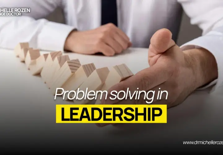 Dr. Michelle Rozen, "The Change Doctor," demonstrates problem-solving in leadership with dominoes. This image is part of leadership coaching news.