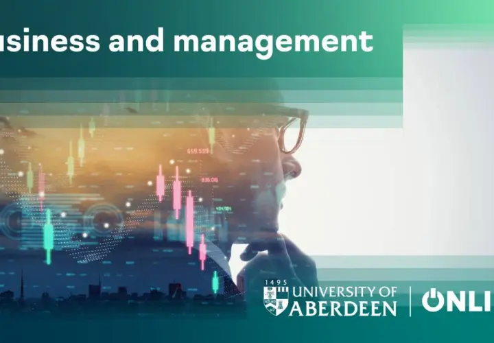 Man in glasses looking at stock market data. Earn your accredited online business administration degree with the University of Aberdeen.