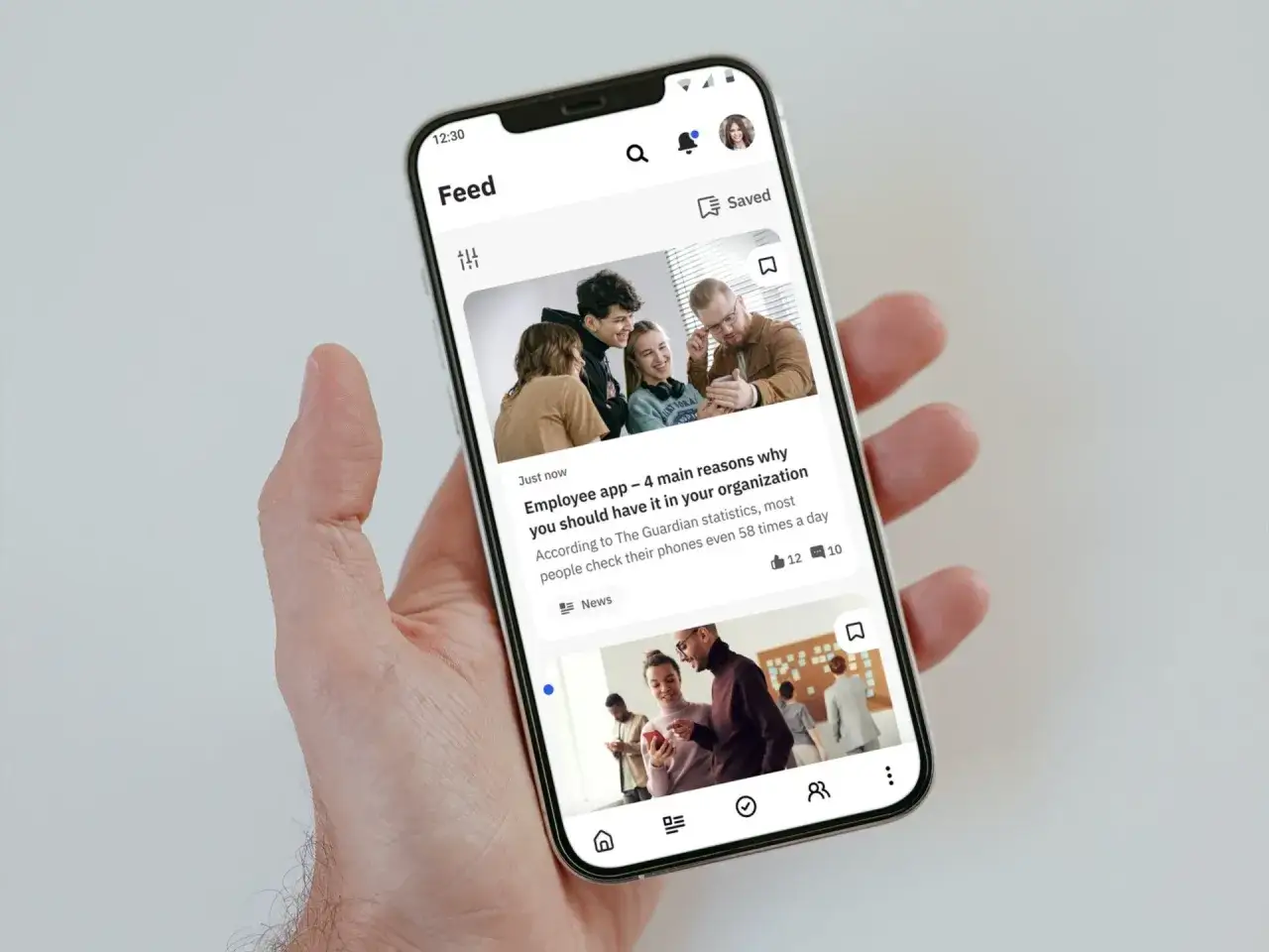 A smartphone displays a feed of articles, showcasing communication solutions for deskless workers.