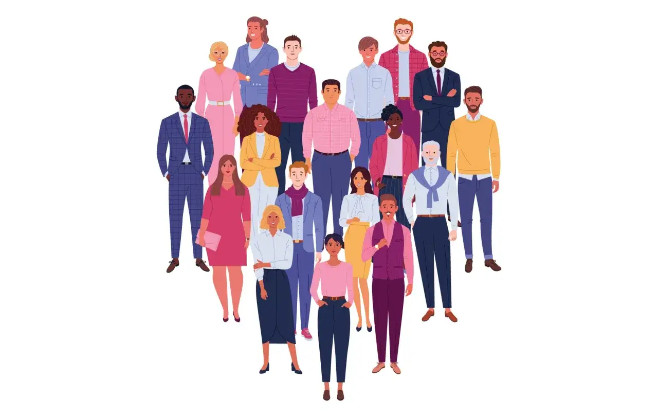 A diverse group of people, representing understanding and compassion, stand together in a heart shape.