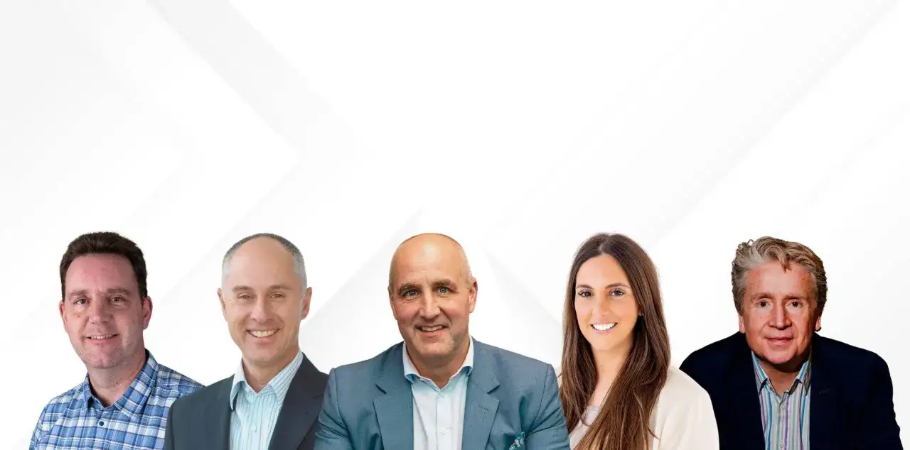 Five smiling professionals, diverse in age and gender, ready for innovation leadership training.