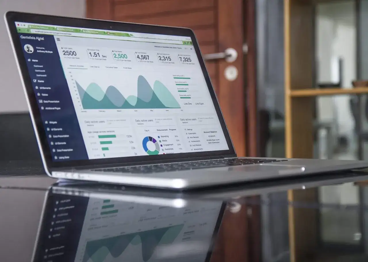 Laptop displaying business intelligence dashboards, perfect for an online business intelligence degree student.